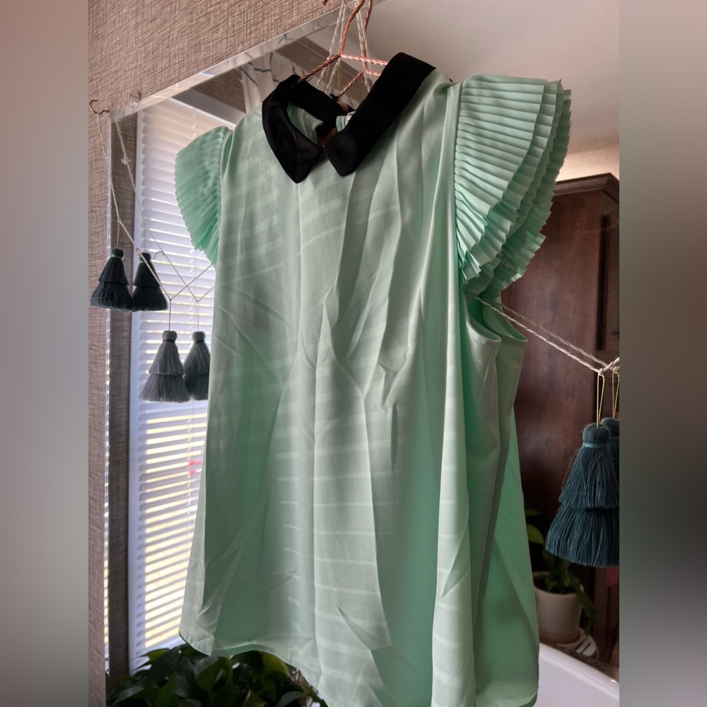 Adorable business top in mint green. Worn once.